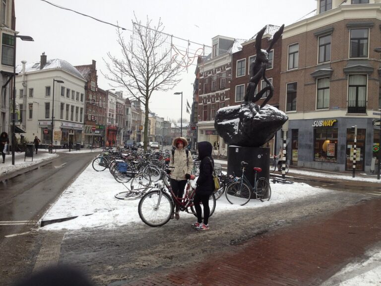 View from Neude square looking down Voorstraat, with snow and finger in front of lens